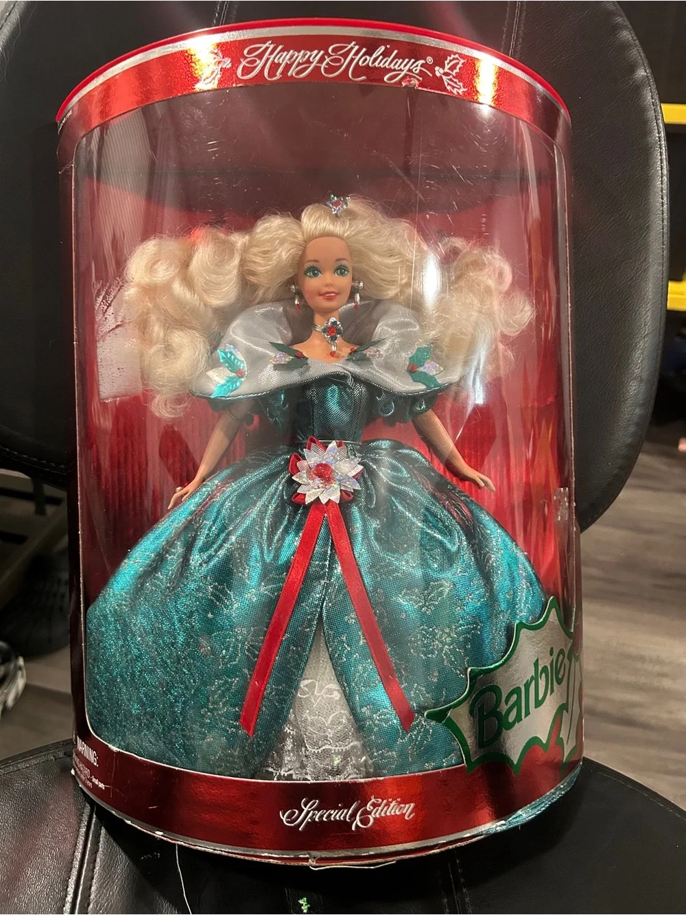 1995 Special Edition Happy Holidays Barbie by Mattel, featuring a distinct emera